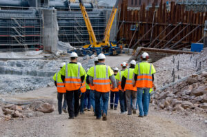 Construction workers walking a construction site.