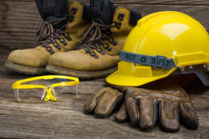 Standard construction safety equipment. Boots, goggles, hard hat, gloves.