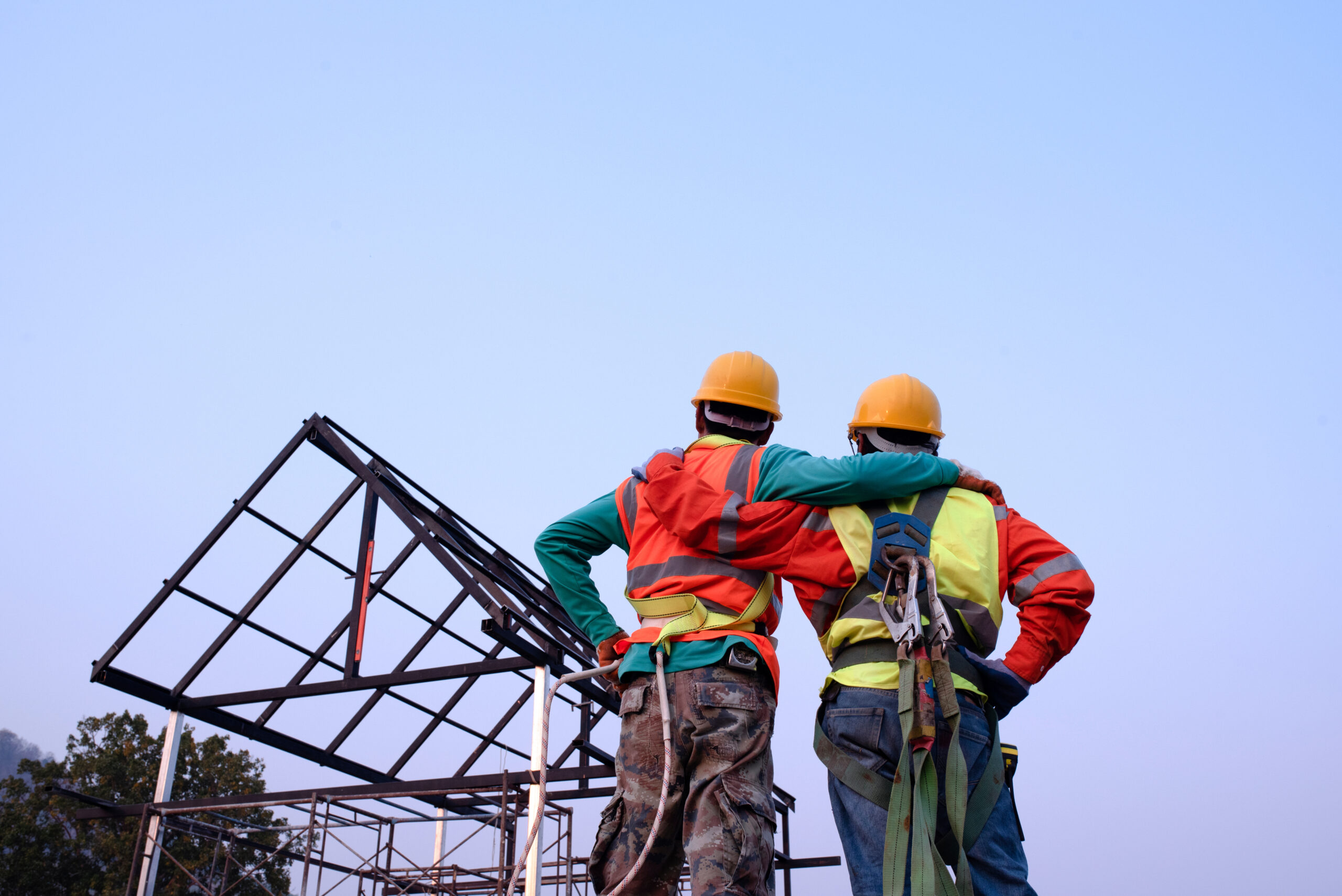Construction team engineers wear steel roof safety inspection uniforms