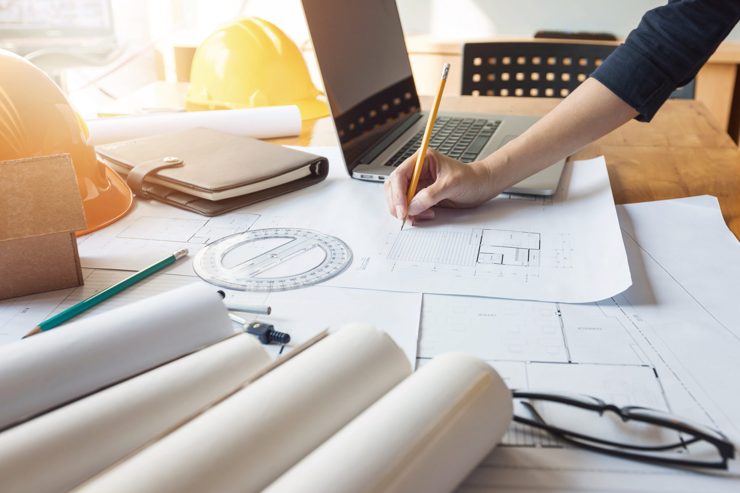 Engineer and Architect concept, Engineer Architects and real estate agent office team working with blueprints