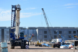 EdgeCore data center campus construction site with drilling rig and crane, representing large scale digital infrastructure buildout and industrial facility development