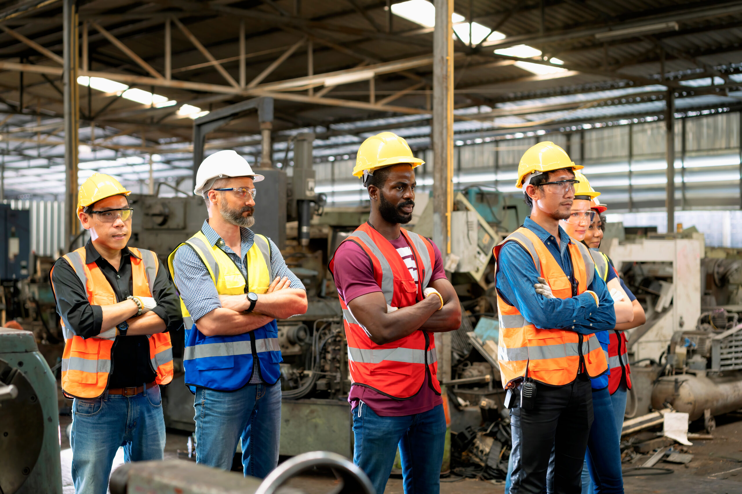 Group Construction Staff Standing In Engineering Factory.